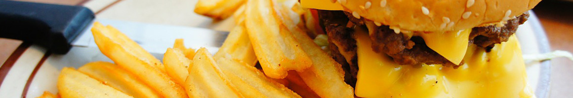 Eating Burger at Barneys Gourmet Hamburgers restaurant in Berkeley, CA.